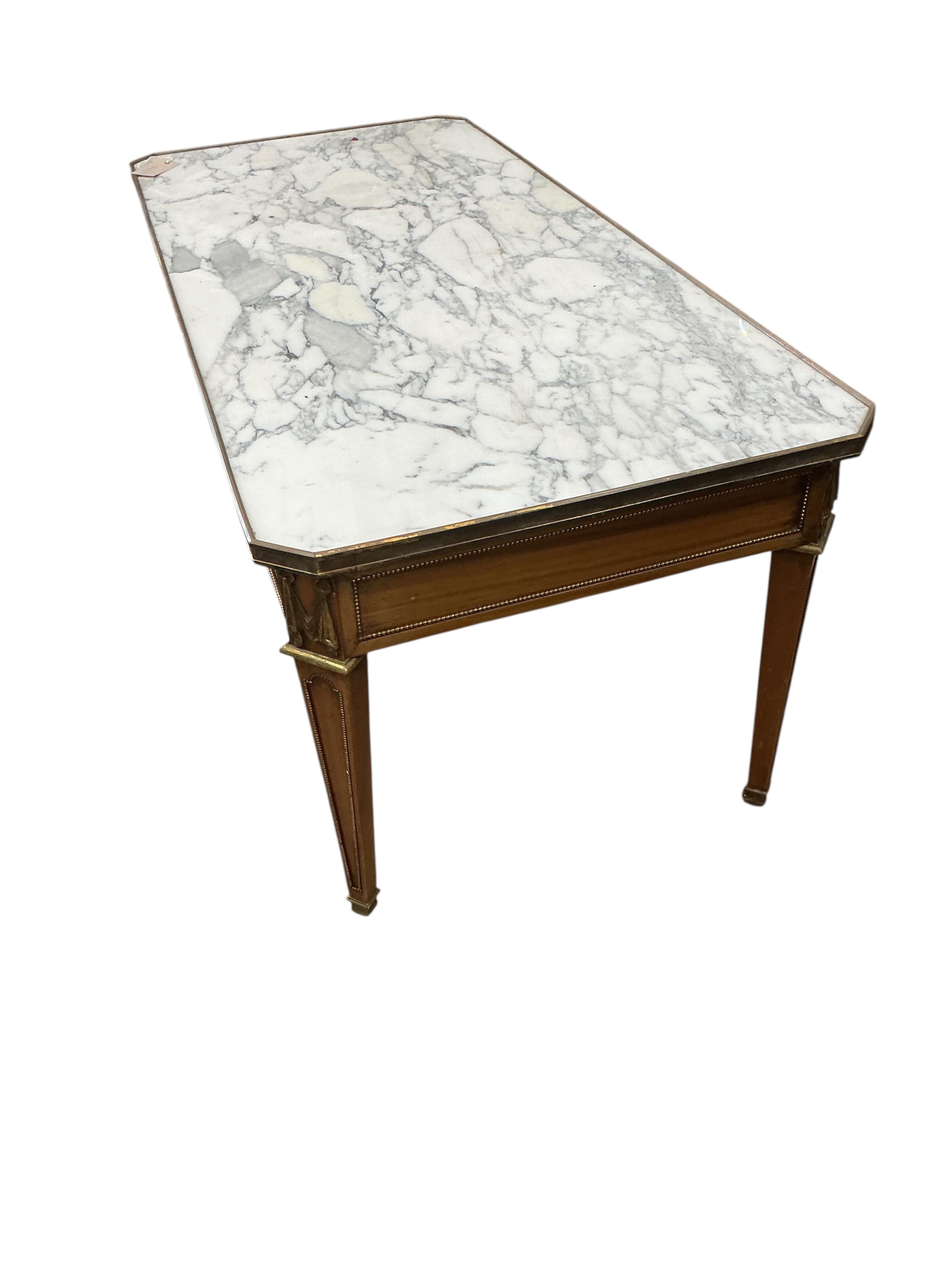 A Louis XVI style brass mounted faux marble top satinwood coffee table, width 110cm, depth 50cm, height 45cm.